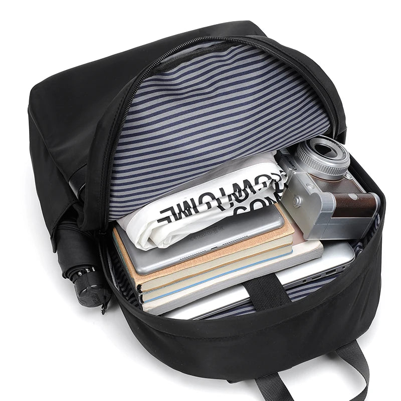 Men's black laptop backpack with a modern, minimalist design.