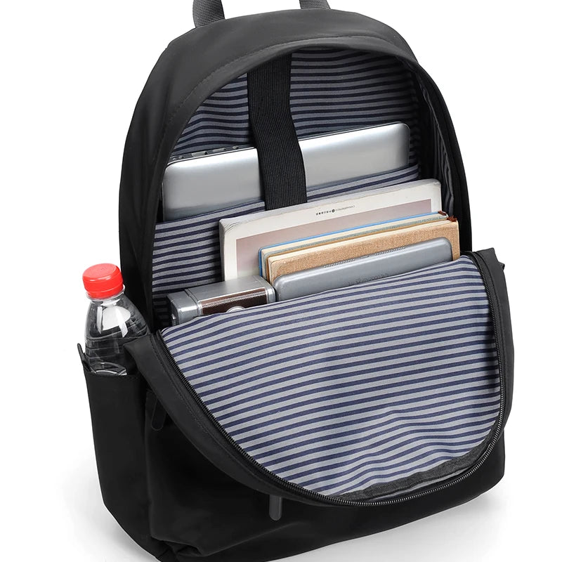Men's black laptop backpack with a modern, minimalist design.