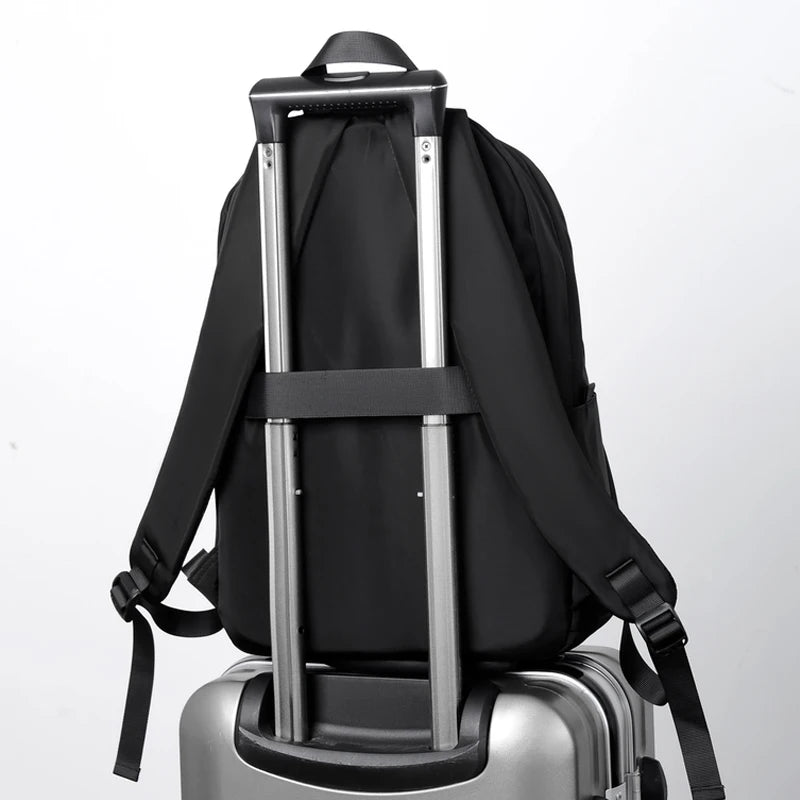 Men's black laptop backpack with a modern, minimalist design.