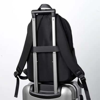 Men's black laptop backpack with a modern, minimalist design.