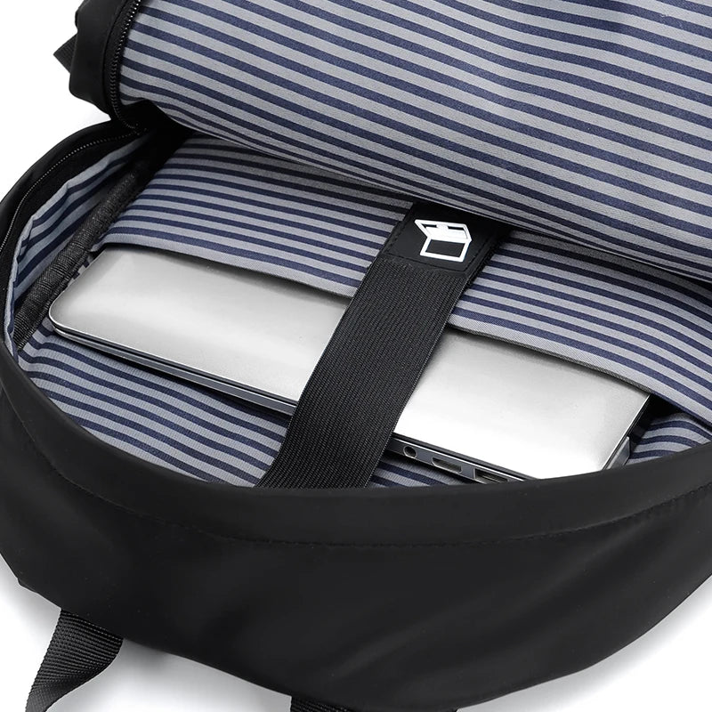 Men's black laptop backpack with a modern, minimalist design.